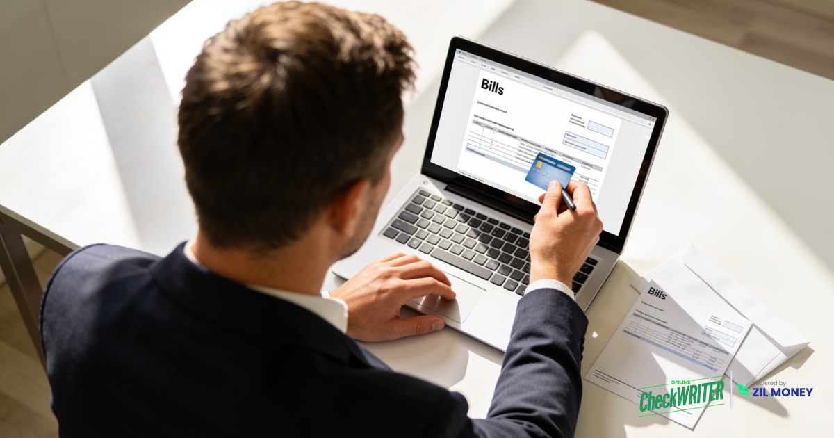 Pay by Check Online Business owner paying by check online on a laptop with OnlineCheckWriter.com