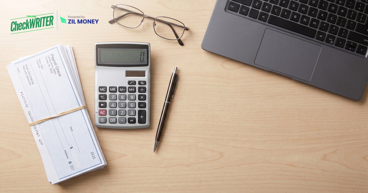 create-payroll-checks Bundle of payroll checks, a calculator and a laptop used to create payroll checks