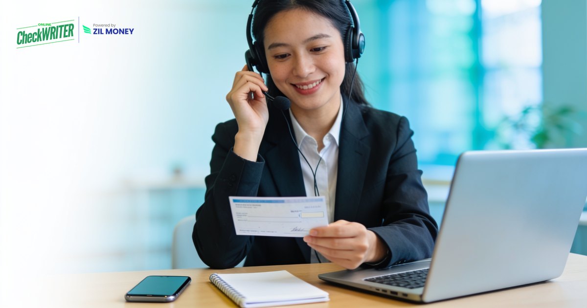 ocw-accept-a-check-payment-by-phone-featured-magnific-071626 Business owner accepting a check payment by phone with a headset and laptop