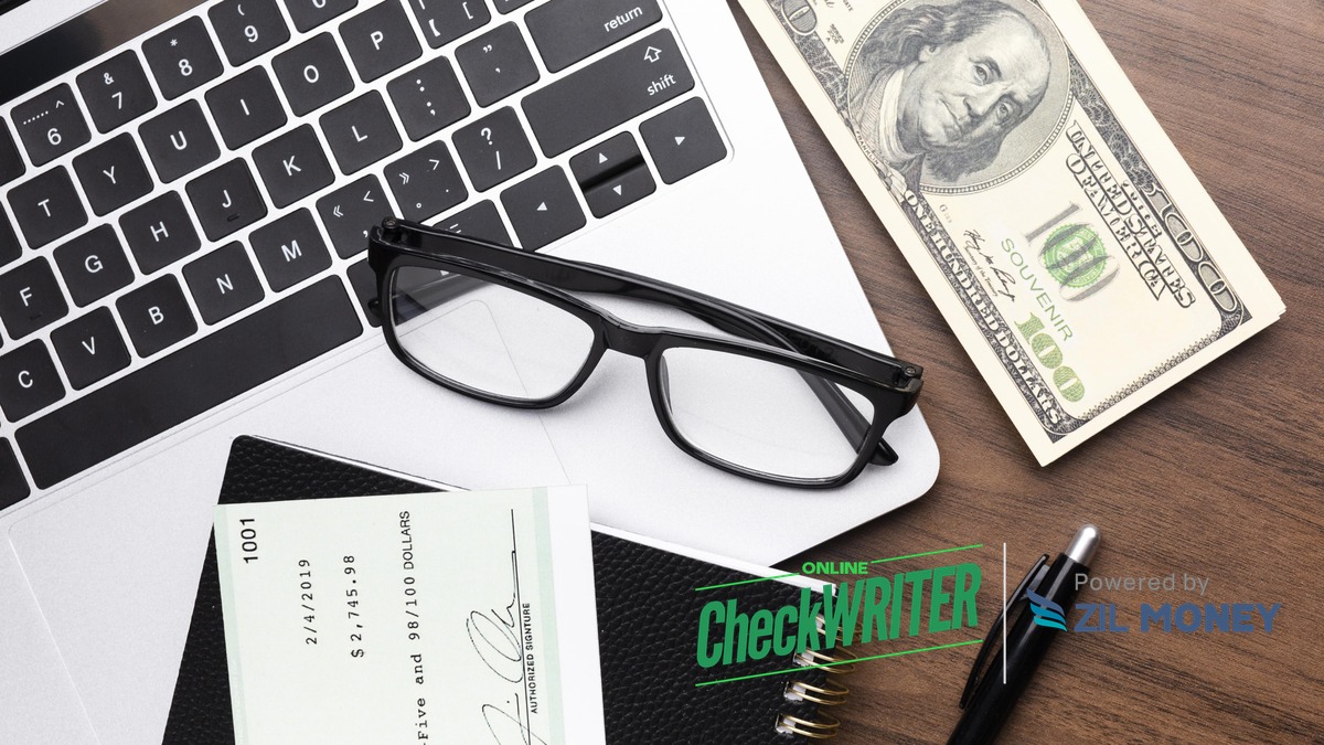 Blank Checks to Print: A Step-by-Step Guide Desk scene with a laptop, glasses, cash, a printed check, and a pen, representing blank checks to print at home or in the office