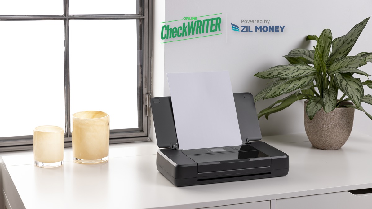 Wells Fargo Checks Taking Too Long Hero Printer with blank paper on a clean desk beside a window, representing on-demand check printing as an alternative to waiting on a Wells Fargo check order